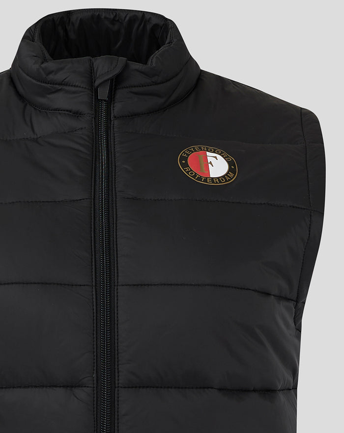 Close-up of the black padded vest showing the circular FEYENOORD logo badge on the chest