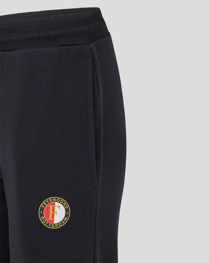 Close up of black Feyenoord Core joggers for women showing side pocket and crest badge on the thigh.