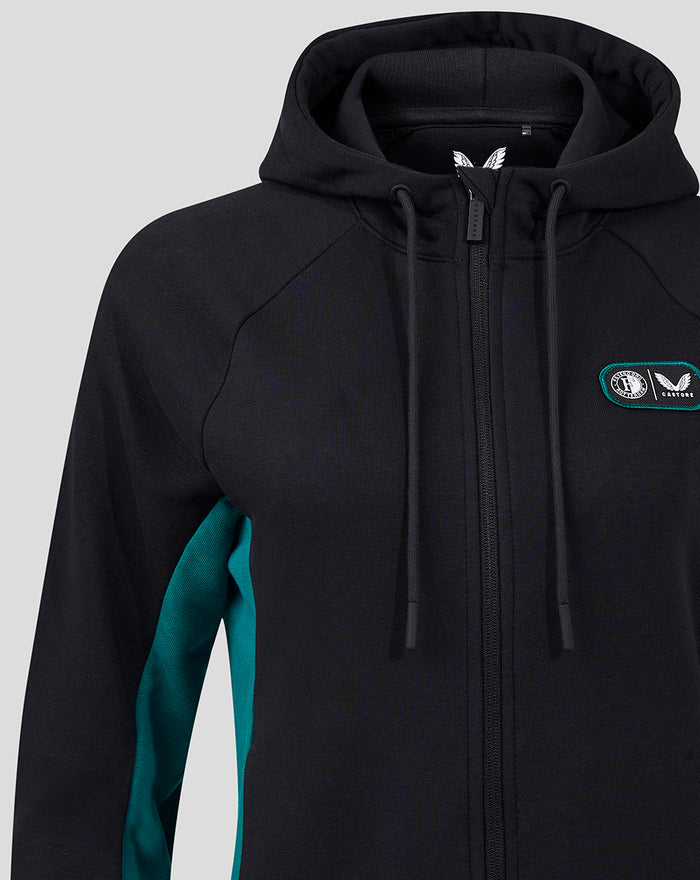 Front view of black fleece jacket with hood teal side panels and chest badge
