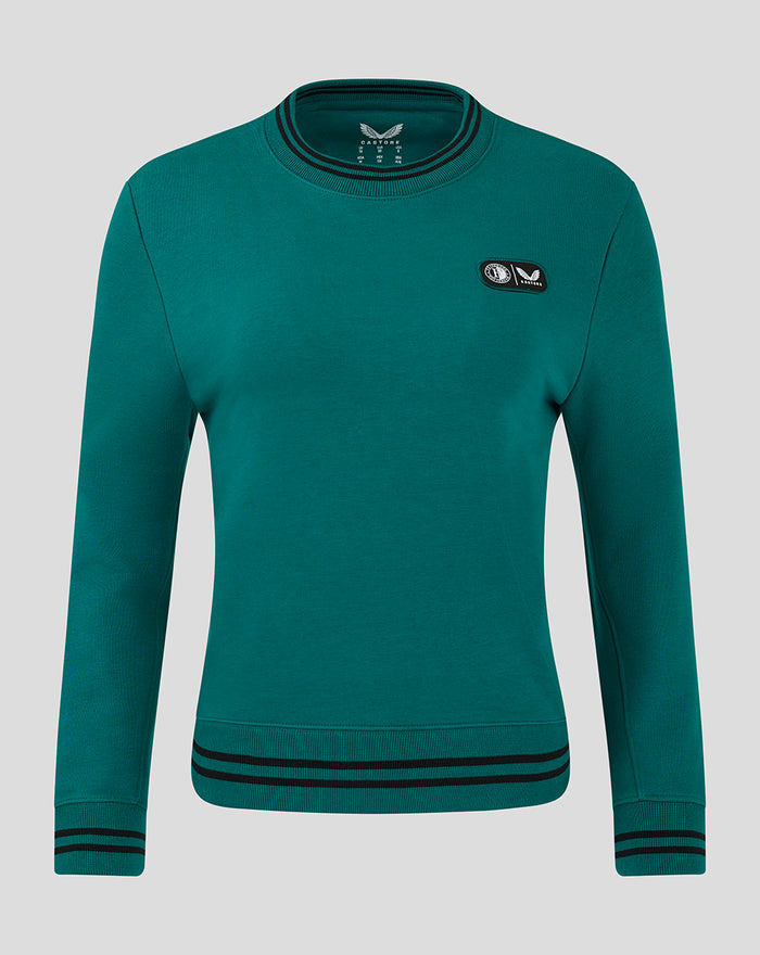 Front view of teal FEYENOORD x Castore fleece crew for women with chest patch and striped ribbed collar and hem