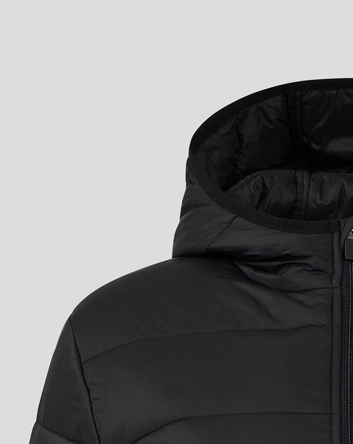 Close up of the zipper and shoulder on a black Feyenoord Core puffer jacket with a small club badge.