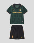 Front view of the Het Twaalfde shirt kids kit 2025 2026 with green jersey featuring the Media Markt sponsor and black shorts with gold trim