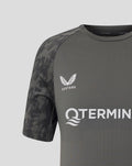 Upper chest detail of the gray Feyenoord training shirt showing the Castore logo and partial TERMINALS branding