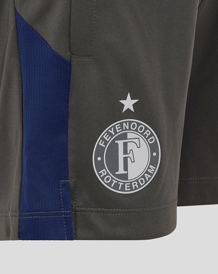 Close up on the leg showing the Feyenoord badge star and Castore logo beside a blue side panel
