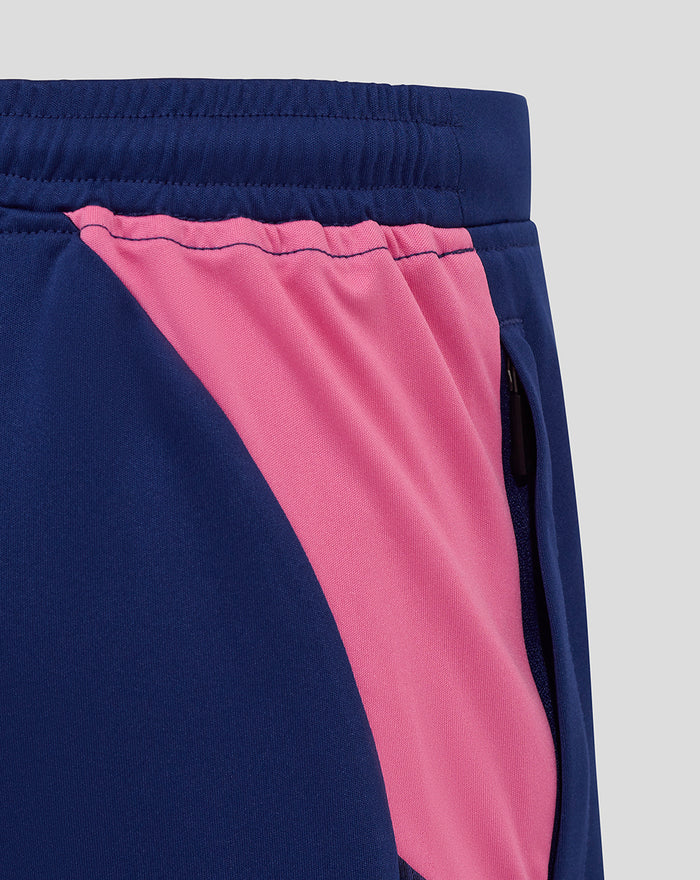 Side zipper pocket on navy shorts with pink side panel.