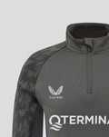 Front close up of the midlayer with a short zipper, displaying Castore logo on right chest and Feyenoord badge on left chest.