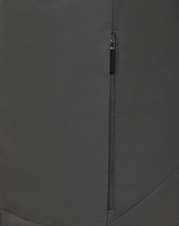 Close up of dark grey training jacket fabric with a vertical zipper