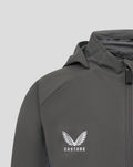 Front view near the zipper of the grey Feyenoord training jacket showing Castore branding on the zipper pull