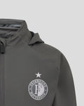 Close up of a grey Feyenoord training jacket chest area featuring the circular club crest and a white star above