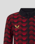 Close up of the left chest featuring the Castore branding and Feyenoord crest on the red polka dot fabric
