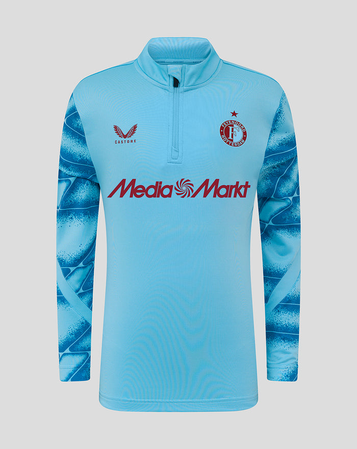 Front view of Feyenoord third Matchday Midlayer Top 2025-2026 junior in light blue with darker blue sleeve print, crest on chest and Media Markt branding