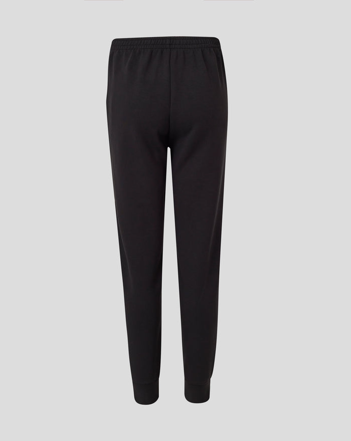 Front view of black junior Feyenoord Travel Knit pant with a sleek sporty look and subtle leg logos.