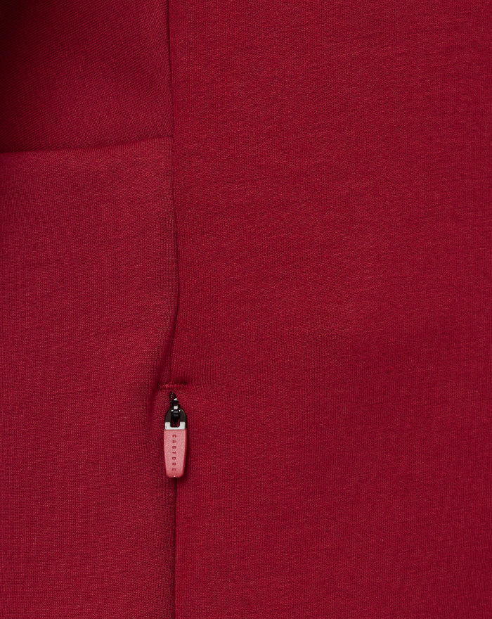 Front view of red Feyenoord Travel Hoody with zipper, Castore logo on left chest and club crest on right.