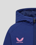 Blue training jacket front detail with pink Castore logo on the chest beside the zipper