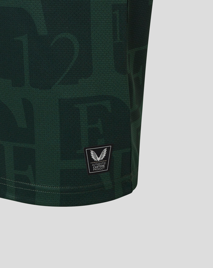 Detail van de zoom van het junior Twaalfde Shirt met Castore authentic product label