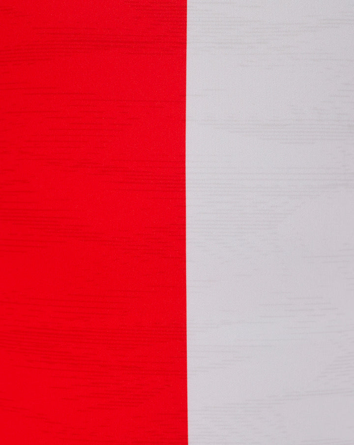 Feyenoord home shirt fabric close up with bold red and white panels