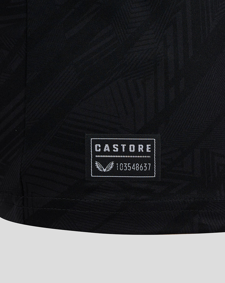 Castore label patch with serial number on the lower hem of a black Feyenoord jersey