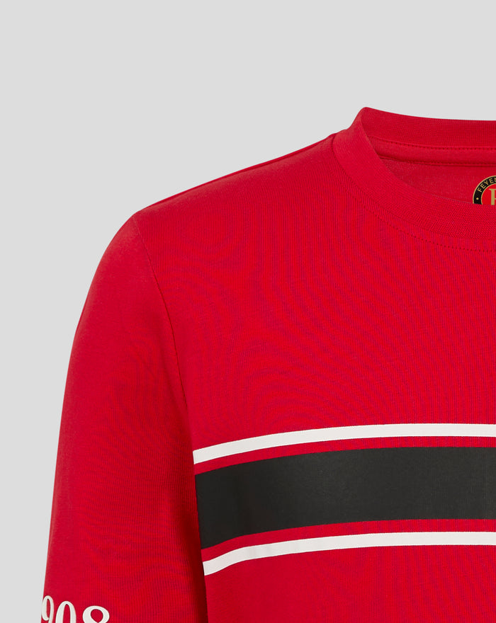 Close up of red Feyenoord Classic Junior T shirt showing upper chest and graphic print with white stripe elements