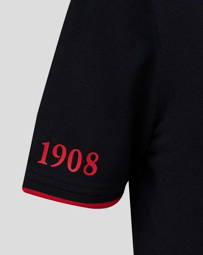 Front view of black Feyenoord Classic Polo Junior showing textured knit fabric and red trim along placket