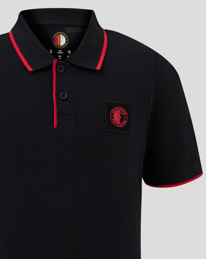 Front close up of black Feyenoord Classic Polo Junior showing crest patch and red piping along placket and sleeve.