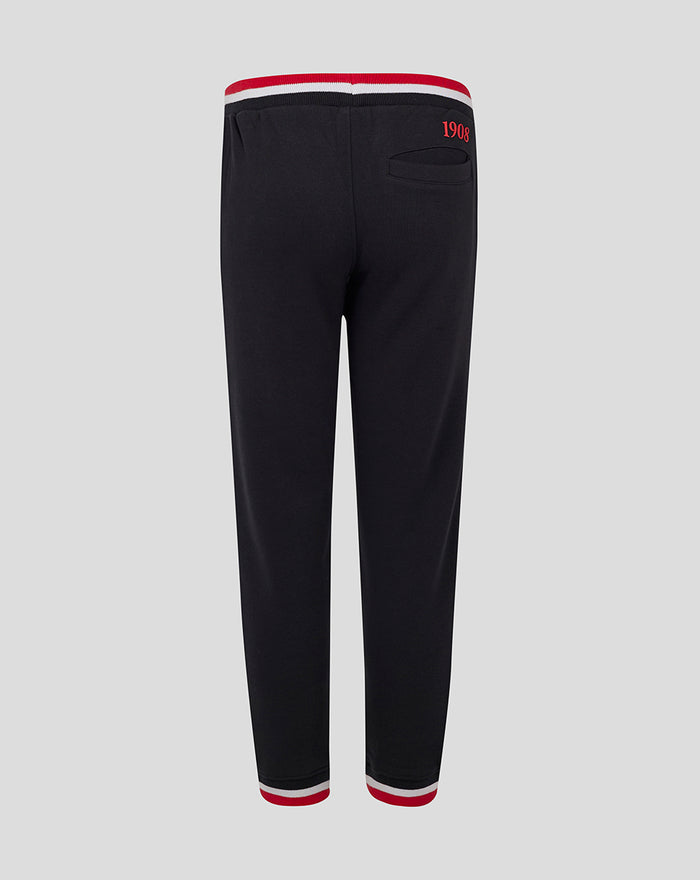 Back view of black junior Feyenoord joggers with a striped red white waistband and 1908 embroidery at the waist with red striped cuffs