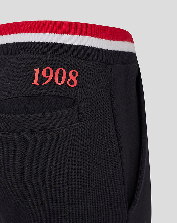 Back detail of black junior joggers with red 1908 embroidery above the rear pocket
