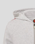 Gray hoodie sleeve with red white and black stripe and a front pocket detail.