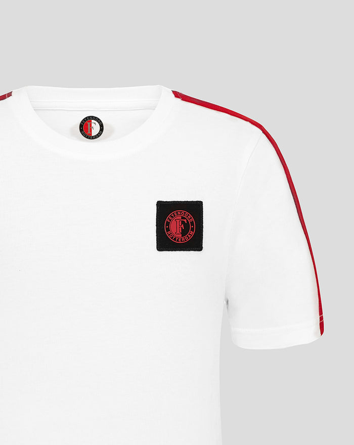 White Feyenoord junior cotton T shirt with red shoulder stripe and black crest patch on the chest