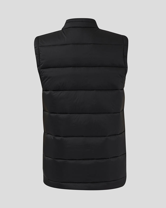 Back view of black Feyenoord Core Junior gilet with horizontal quilted panels and stand collar.