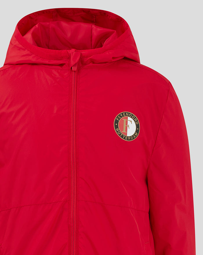 Close-up of the circular Feyenoord logo on the red junior jacket