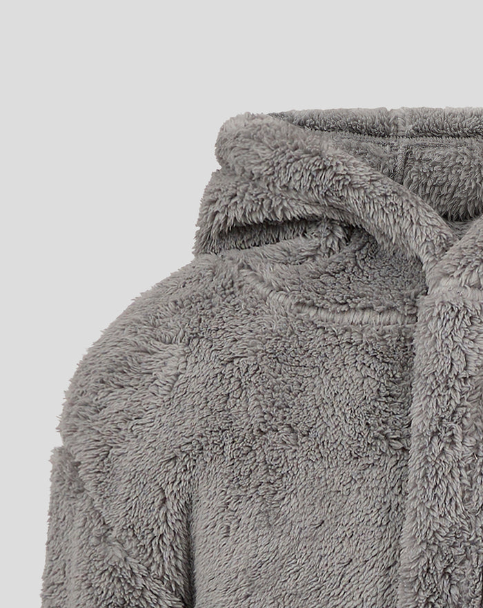 Close up of a grey fluffy children's Feyenoord jacket showing soft plush fabric and a hood