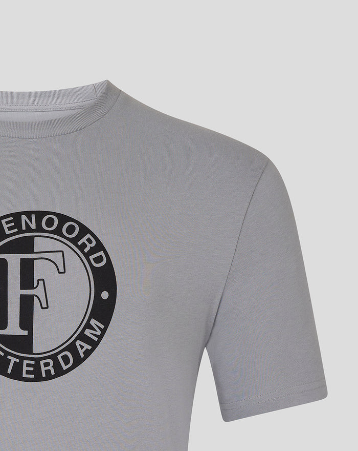 Close up of the upper front displaying the black circular Feyenoord emblem on the grey T shirt.