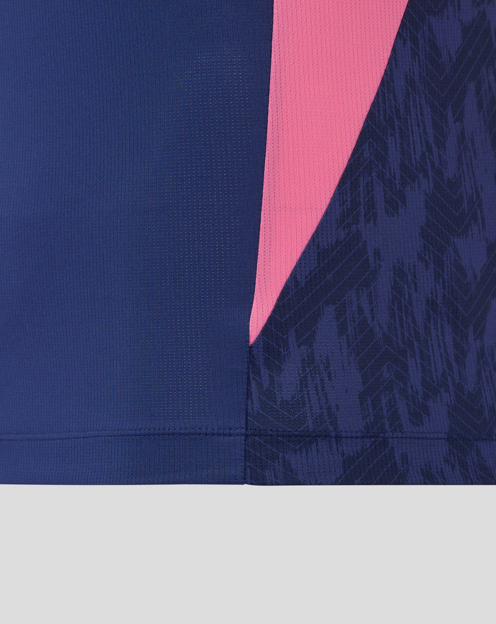 Close-up of Feyenoord training T shirt fabric in navy with a pink side panel and printed detailing