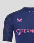 Close-up front of navy Feyenoord training shirt featuring pink branding across the chest and crest.