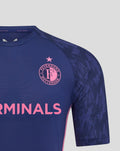 Close view of navy Feyenoord training shirt front showing Feyenoord crest on left chest and Castore logo on right chest.