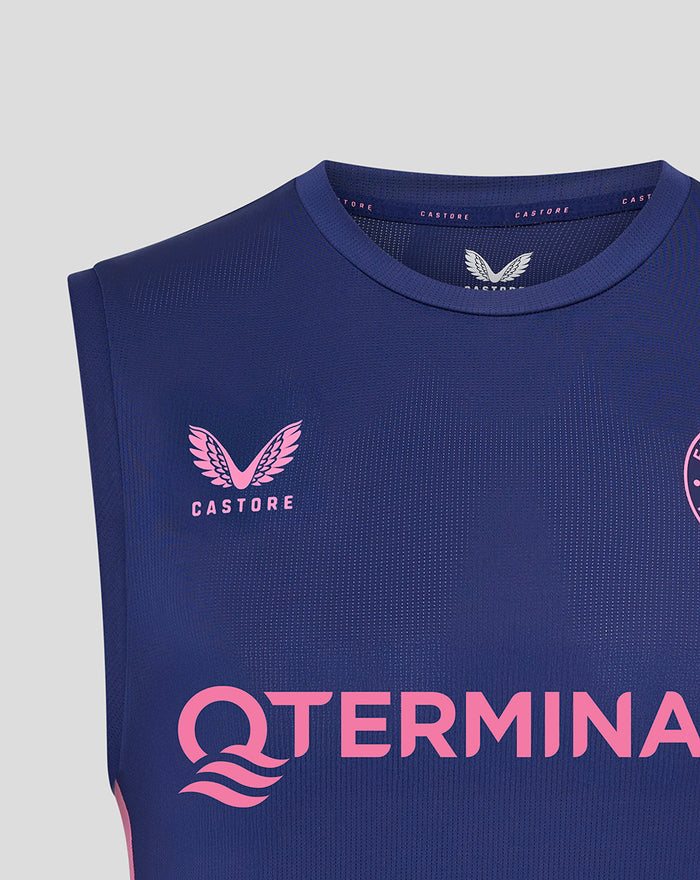 Close-up of neck and upper chest on blue sleeveless training shirt showing pink Feyenoord crest and Castore branding