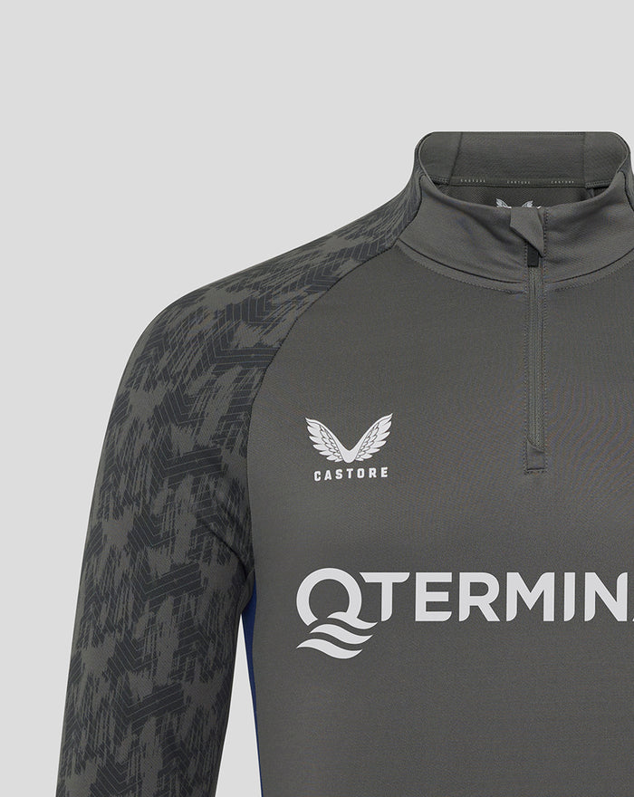 Close-up of the chest area on a dark Feyenoord Coaches Training Midlayer Top showing Castore logo and club crest.