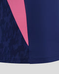 Close-up of blue training midlayer with a pink angled panel and textured sleeve pattern.