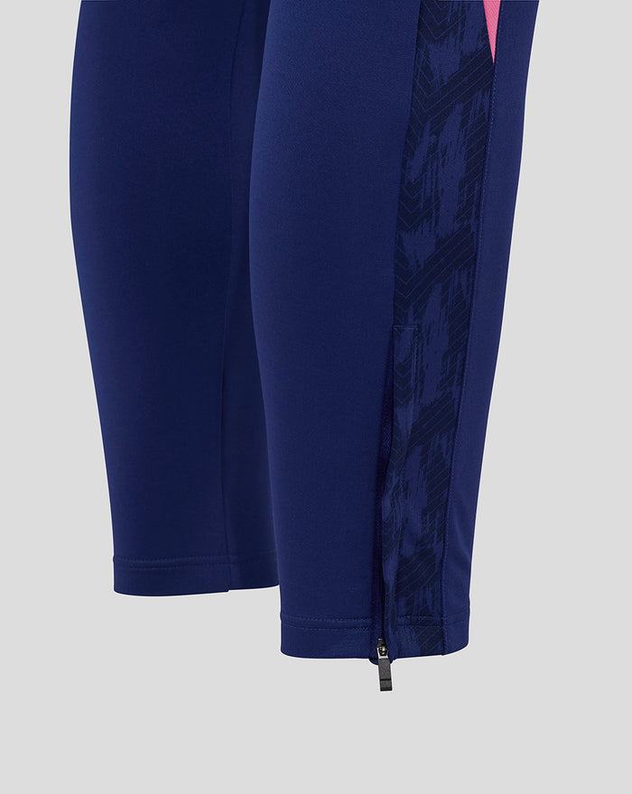 Navy training pants with a side zipper at the cuff and a dark patterned strip along the leg.