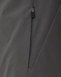 Close up of the zipper on a dark gray Feyenoord training jacket with Castore branding