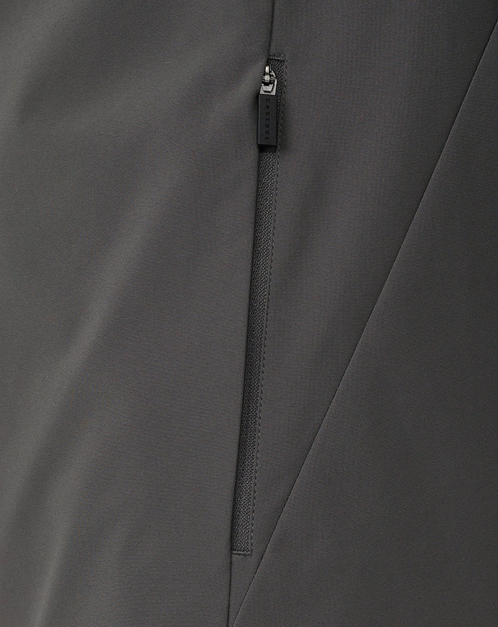 Close up of the zipper on a dark gray Feyenoord training jacket with Castore branding