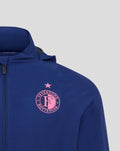 Close-up of blue training jacket chest showing pink Feyenoord crest with star above.