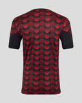 Back view of Feyenoord Thuis Matchday T-shirt with a bold red dot pattern on dark fabric