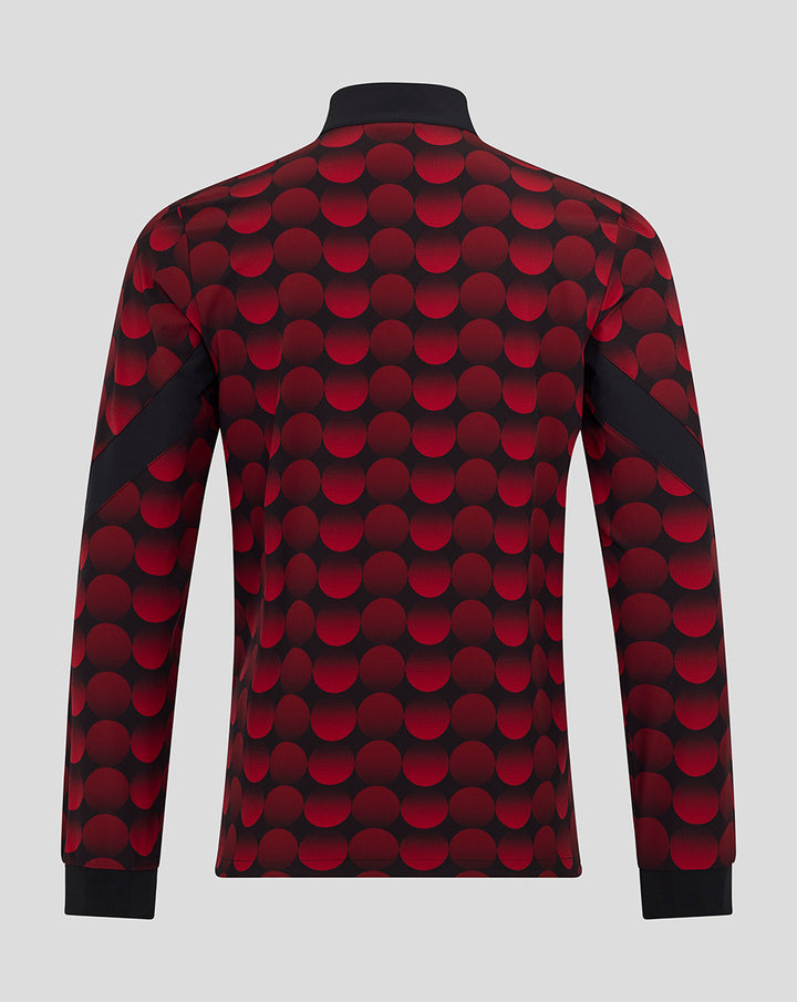 Back view of Feyenoord home matchday jacket with red and black polka dot pattern and black cuffs