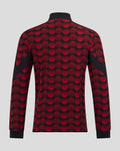 Back view of Feyenoord home matchday jacket with red and black polka dot pattern and black cuffs