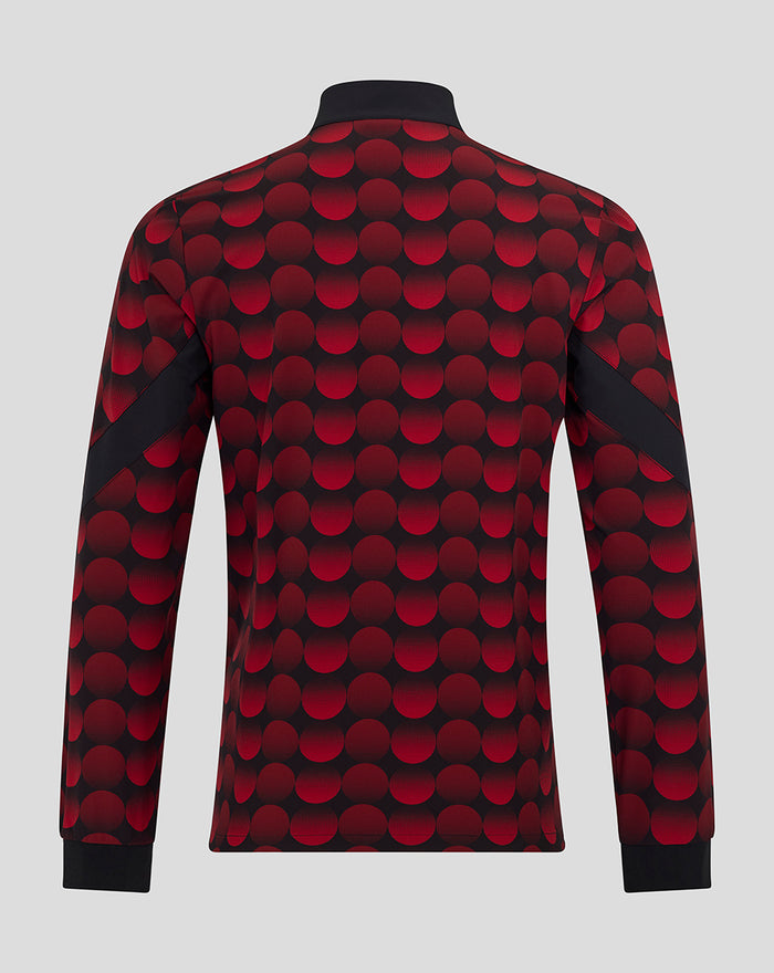 Back view of Feyenoord home matchday jacket with red and black polka dot pattern and black cuffs
