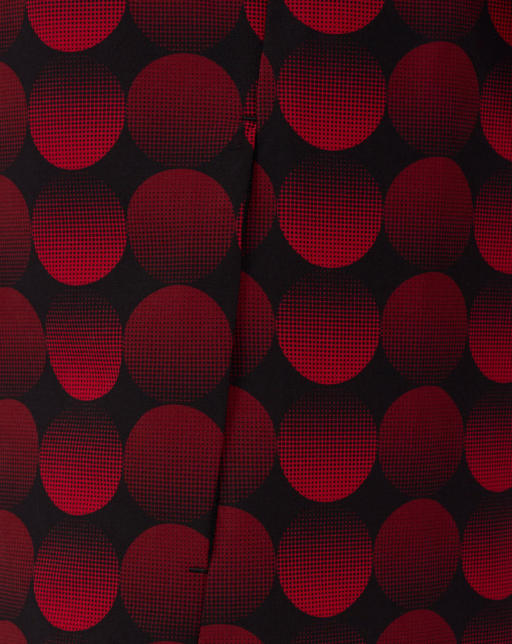 Close up of red halftone dot pattern on black fabric, part of the Feyenoord Thuis Matchday Jacket design.