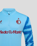 Front view of light blue Feyenoord Derde Matchday Midlayer Top featuring crest on the chest, quarter zip, and blue sleeve print.