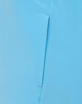 Close-up of light blue fabric with a vertical seam from a lightweight athletic jacket