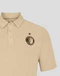 Close up of beige Feyenoord Travel Polo front with club crest and star above the badge